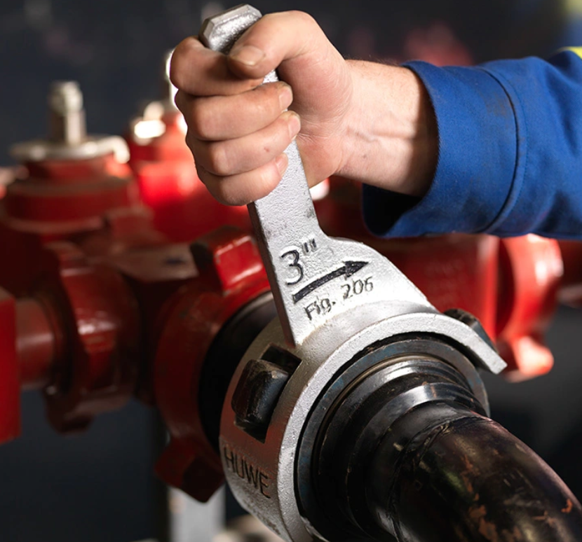 HUWE wrench used on a pipe connection