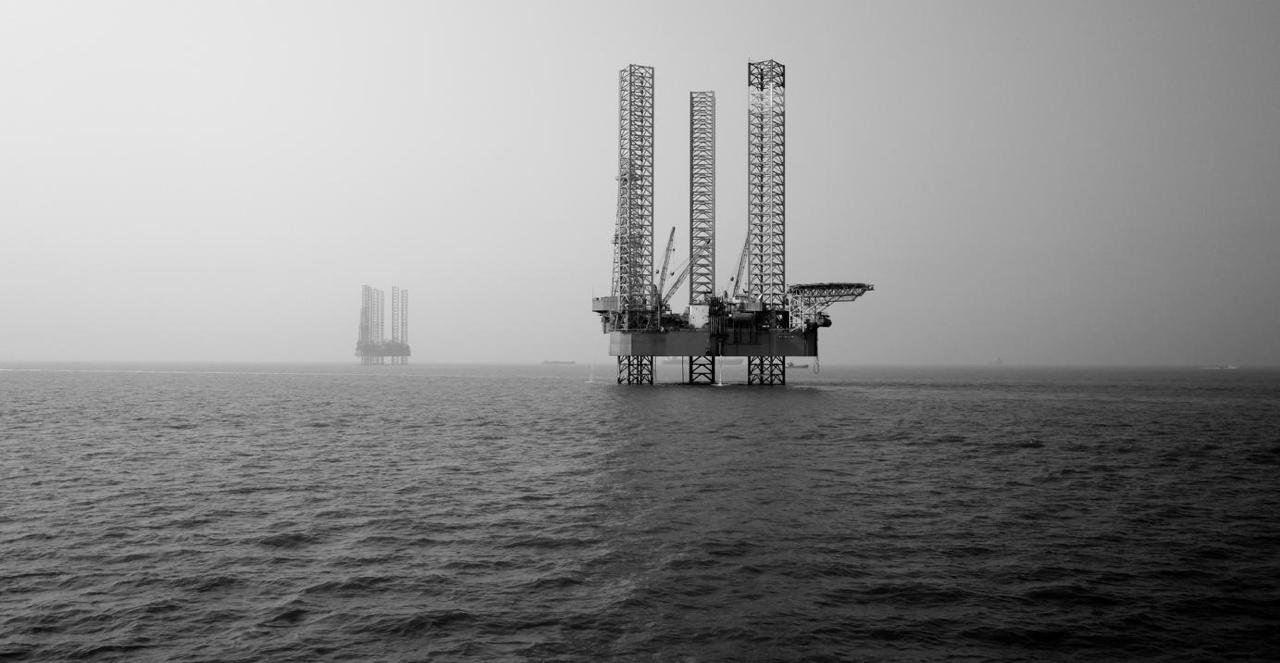 Original offshore photograph of jack-up rigs at sea